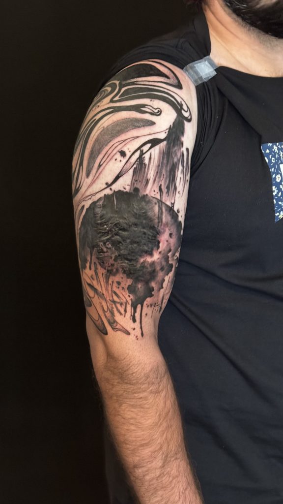 Black abstract scar cover up tattoo