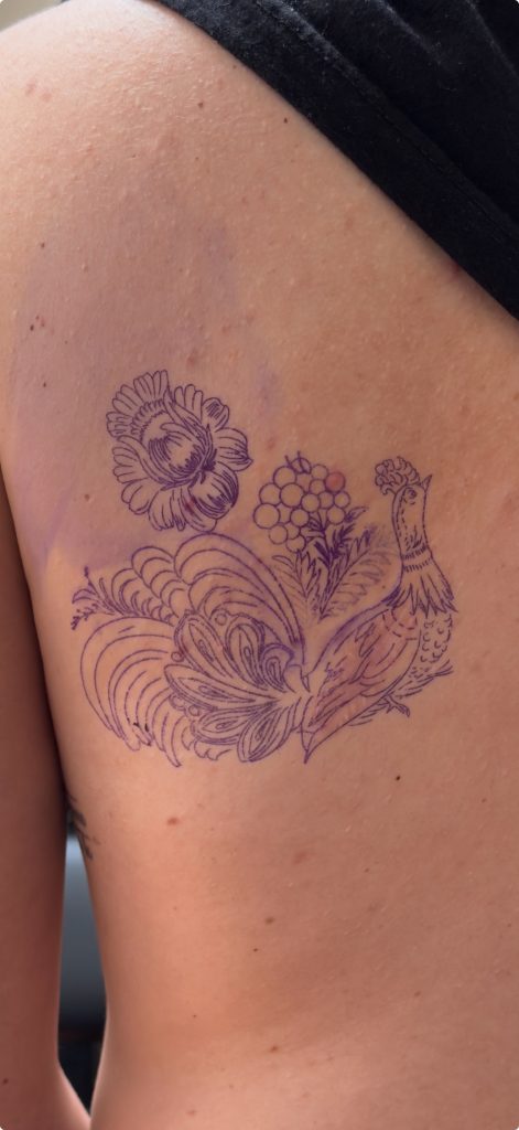 Tattoo stencil covering scar