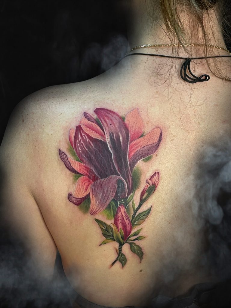 Large pink magnolia tattoo cover-up
